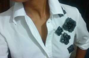the brooches on a white shirt