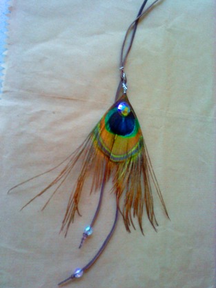 the necklace i made with a peacock feather and some beads